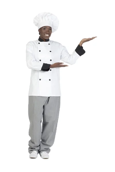 Шеф-кухар з жестом, що показує щось — стокове фото