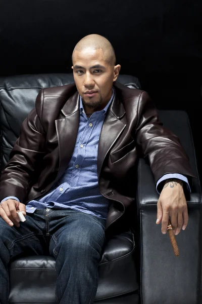 Portrait of a businessman holding a cigar — Stock Photo, Image