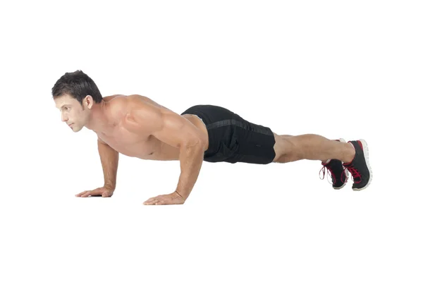 Musculoso hombre haciendo push up — Foto de Stock