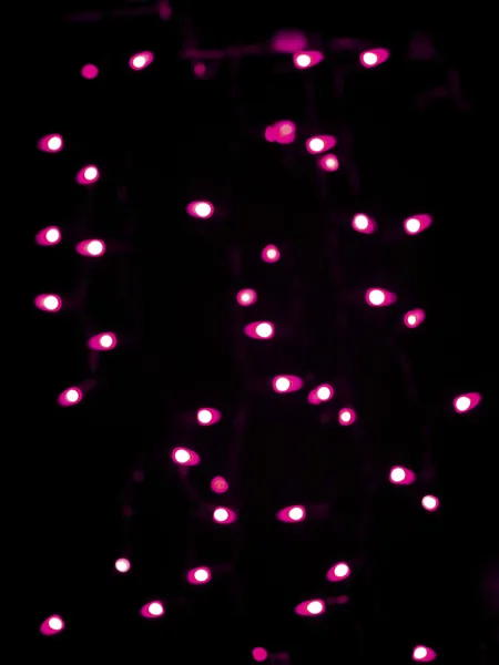 Defocused image of pink halloween neon lights — Stock Photo, Image