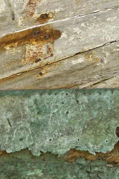 Close up shot of metal nailed on wood — Stock Photo, Image