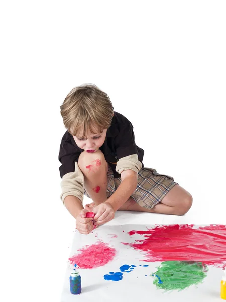 Elementary child doing painting — Stock Photo, Image