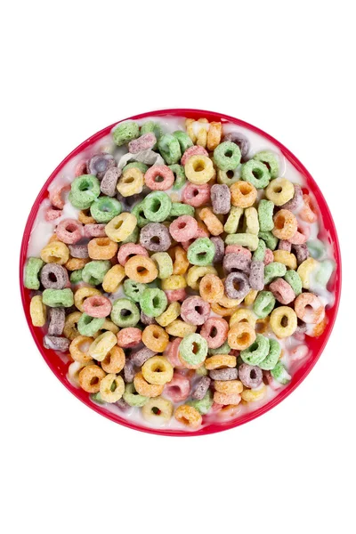 Un tazón con coloridos cereales con leche —  Fotos de Stock