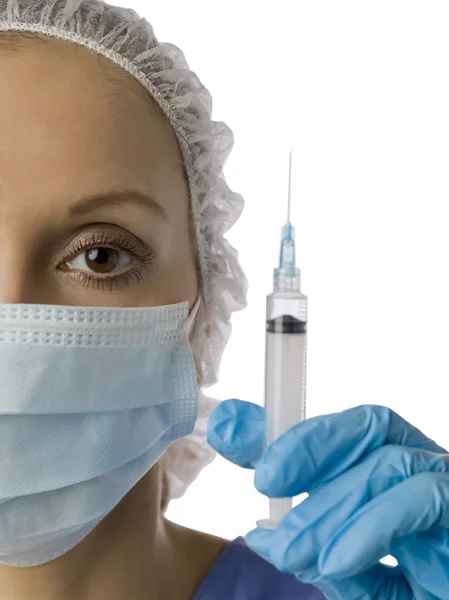 A doctor with a mask holding syringe — Stock Photo, Image