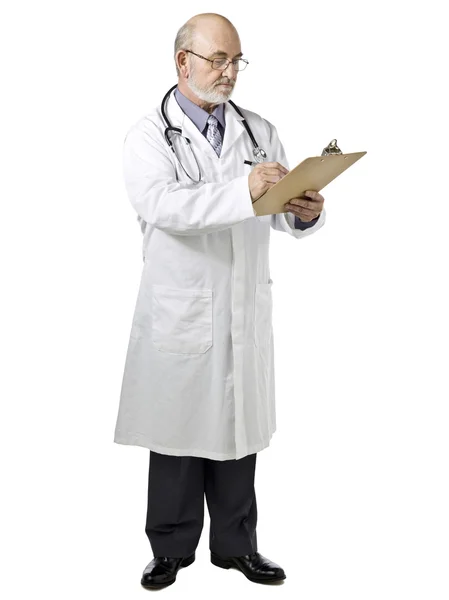 A doctor writing on the medical clipboard — Stock Photo, Image