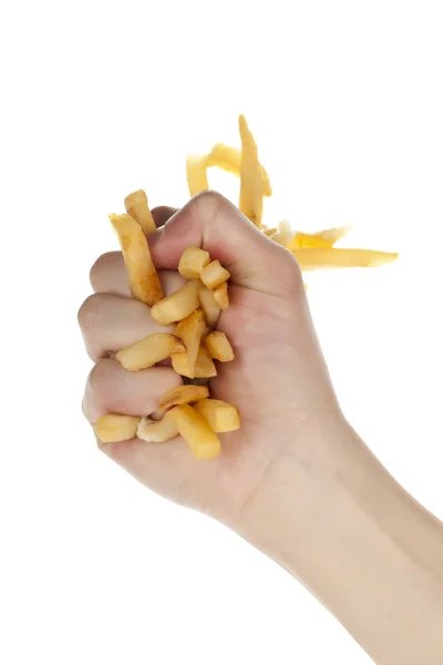 Uma mão agarrando as batatas fritas — Fotografia de Stock