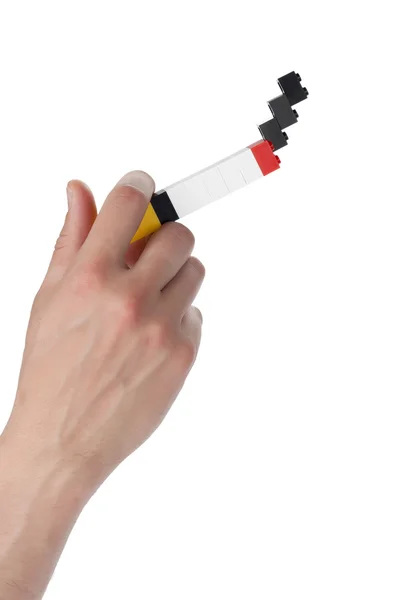 A hand smoking a lego cigarette — Stock Photo, Image