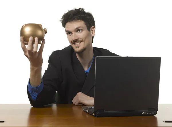 Un hombre de negocios feliz sosteniendo alcancía — Foto de Stock