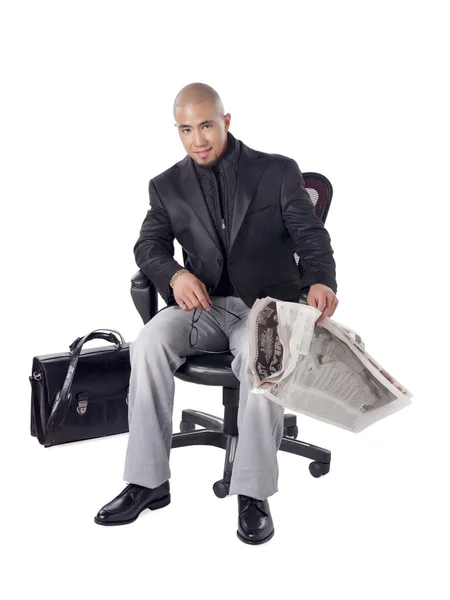 A happy businessman with newspaper — Stock Photo, Image