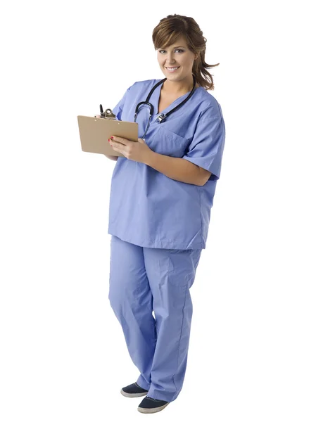 A happy doctor writing on the medical clipboard — Stock Photo, Image