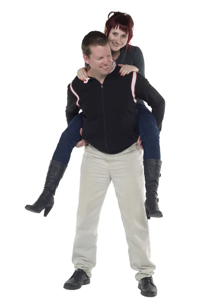 彼の背中には女性を運んでいる幸せな男 — ストック写真