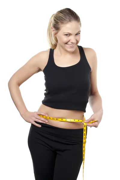 A lady measuring her waist — Stock Photo, Image