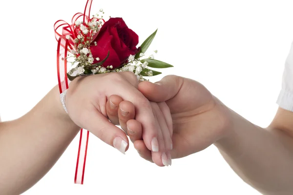 Uma senhora com vermelho rosa corsage — Fotografia de Stock