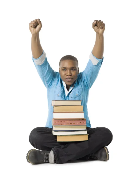 Um estudante masculino bem sucedido com livros — Fotografia de Stock