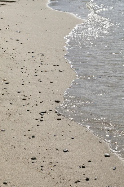 A hullám a víz megy a partra, puerto Galera — Stock Fotó