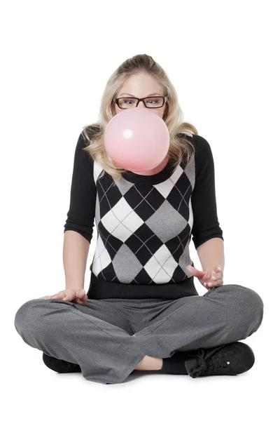 A woman inflating a bubble gum — Stock Photo, Image