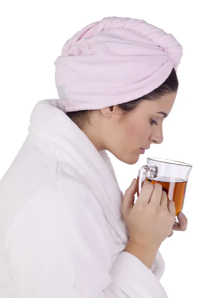 A woman wearing bathrobe drinking tea — Stock Photo, Image