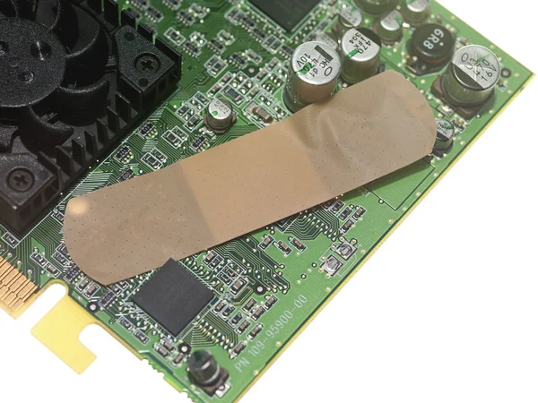 Adhesive bandage on circuit board — Stock Photo, Image