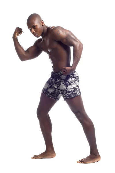 Afro americano uomo flessione muscoli — Foto Stock