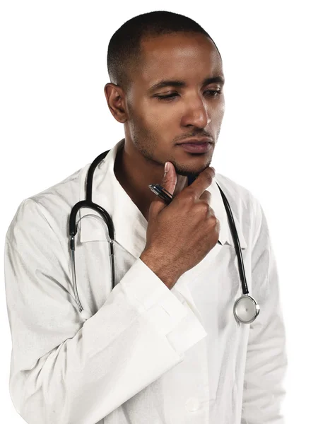 African american young doctor with hand on chin — Stock Photo, Image