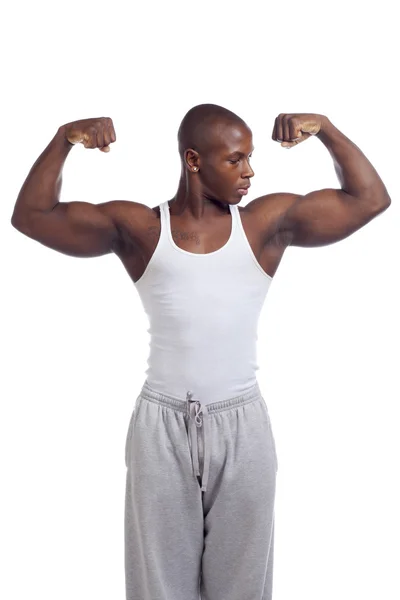 Afrykański mężczyzna wyginanie mięśni — Zdjęcie stockowe