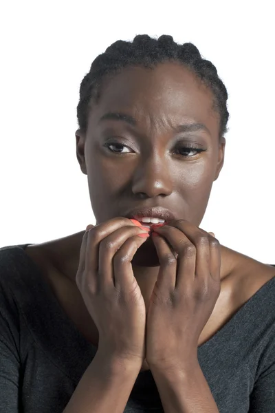 African woman biting her nails — Stock Photo, Image