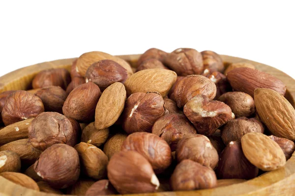 Almond and walnut on wooden bowl — Stock Photo, Image