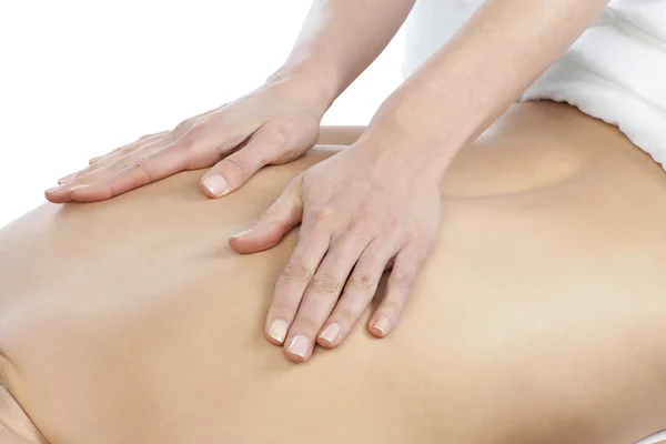 A lady getting a back massage by a masseur — Stock Photo, Image