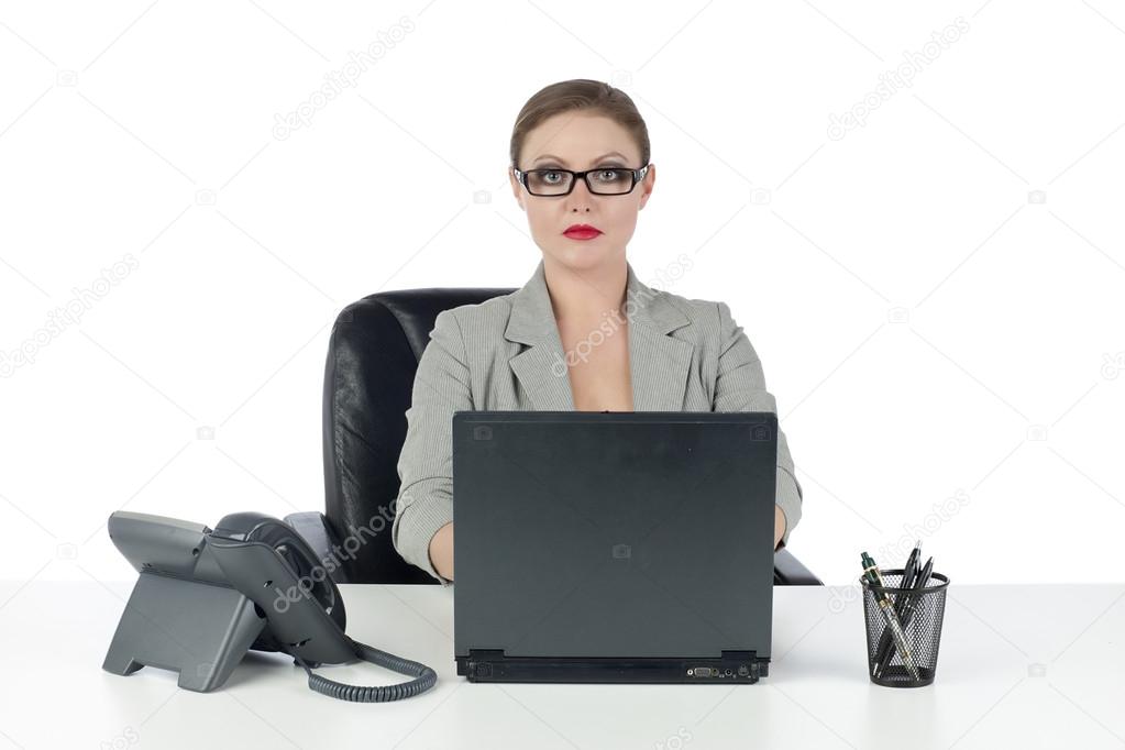 a strict businesswoman sitting on the chair