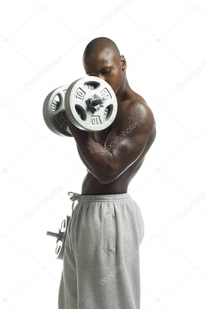 african american muscular man working out with dumbbell