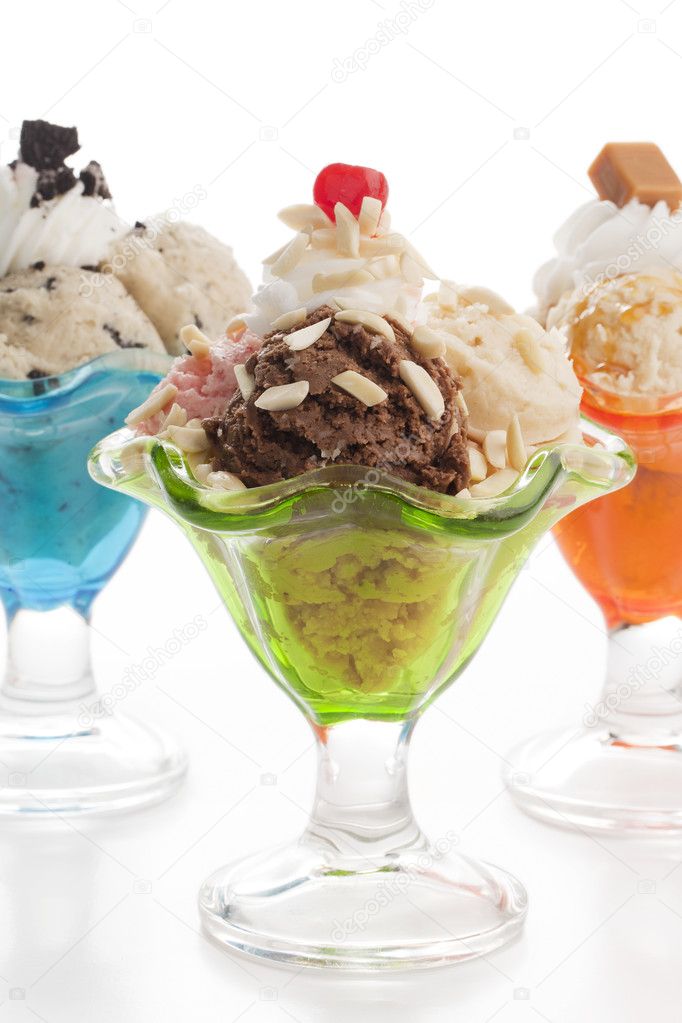an ice cream on a cup with toppings