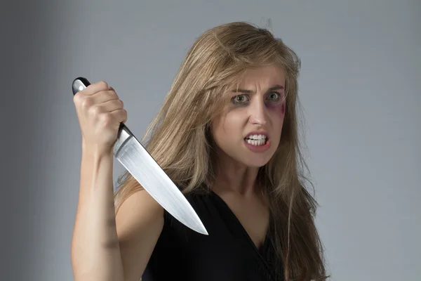 Angry woman with knife — Stock Photo, Image