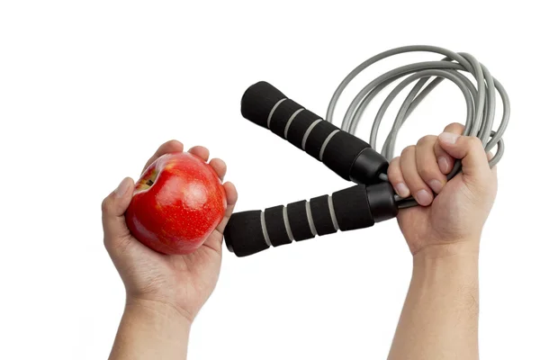 Яблуко і стрибає мотузка — стокове фото