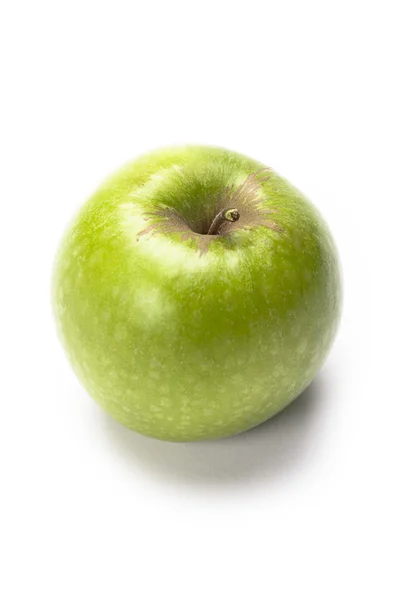 Яблоко на белом холсте — стоковое фото