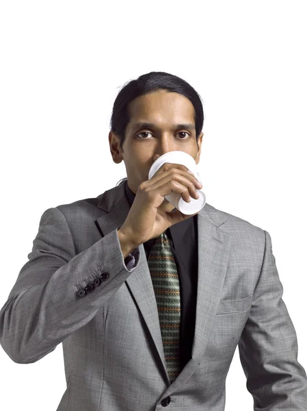 Азиатский бизнесмен с кофе — стоковое фото