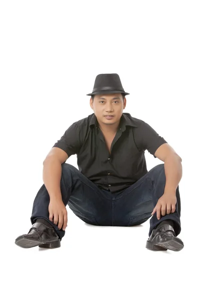 Asian guy sitting on the floor — Stock Photo, Image