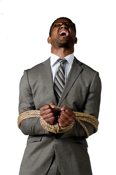 An angry businessman with rope tied on his hand — Stock Photo, Image