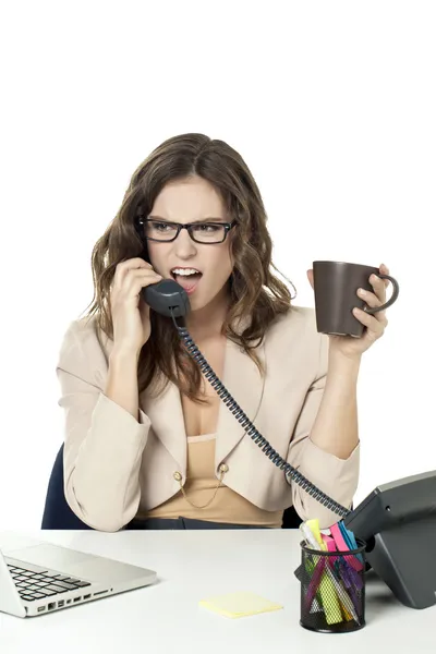 An angry businesswoman answering phone call — Stock Photo, Image