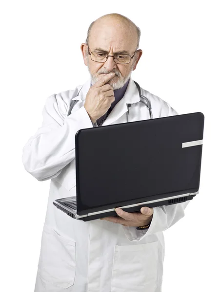 An upset male doctor holding laptop — Stock Photo, Image