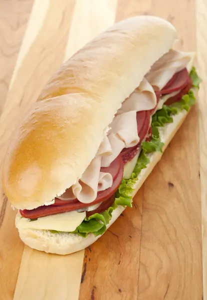 Appetizing ham and salami sandwich — Stock Photo, Image