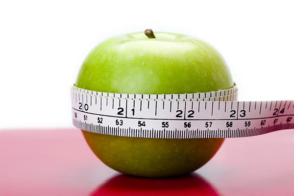 Apple being measured — Stock Photo, Image