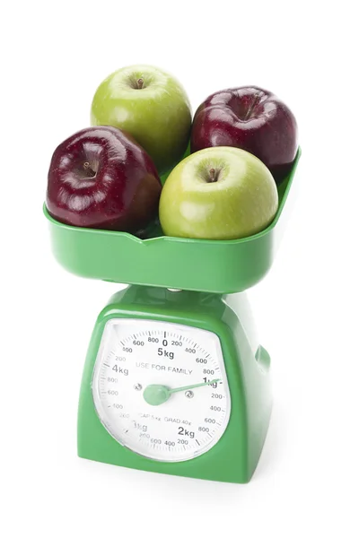 Apples on a kitchen food scale — Stock Photo, Image