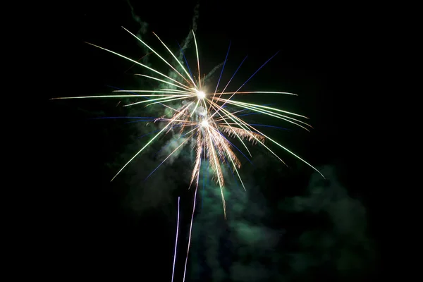 A mix of blue green and yellow fireworks — Stock Photo, Image