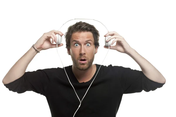 Egy döbbent ember fejhallgató — Stock Fotó