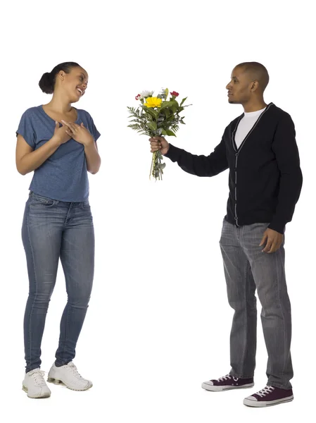 Un hombre dando flores a su novia — Foto de Stock