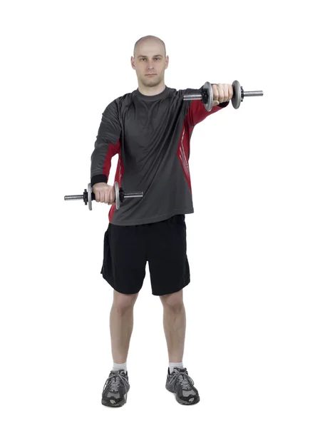 Athletic male using dumbbells — Stock Photo, Image