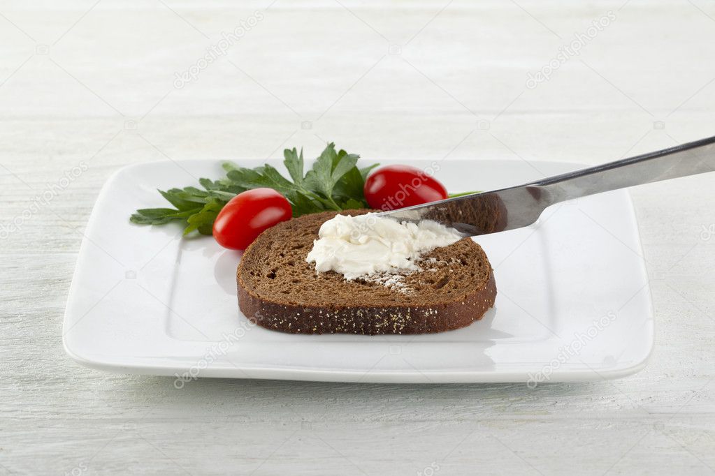 a plate with chocolate bread with a butter spread