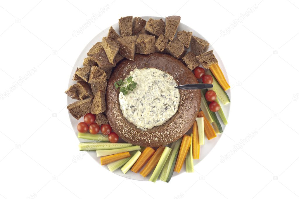 a plate with pumpernickel bread and spinach dip