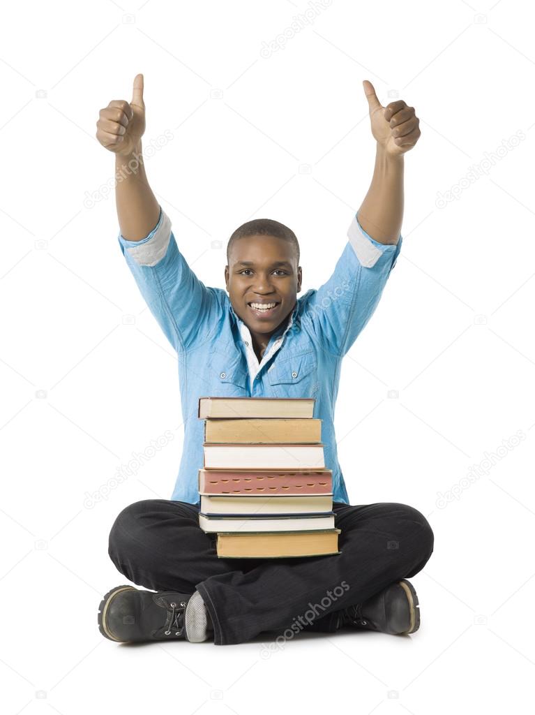 a male student holding books with approved hand