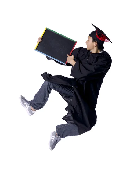 Um homem graduando segurando placa preta — Fotografia de Stock